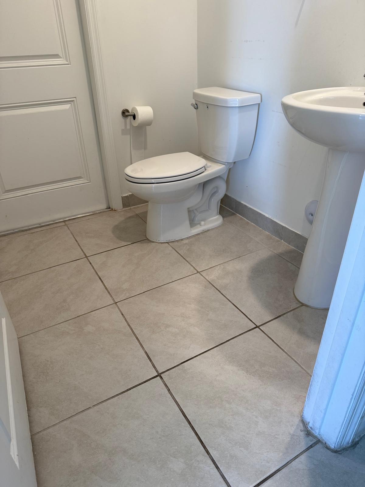 12736 Southwest 211th Street Miami, FL 33177 - Photo 12 of 18 a bathroom with a toilet and a sink