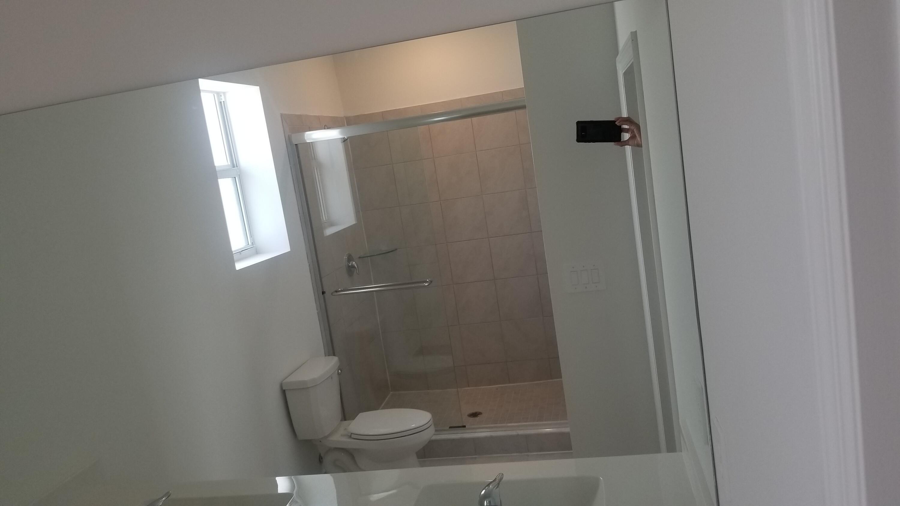 12736 Southwest 211th Street Miami, FL 33177 - Photo 10 of 18 a bathroom with a shower