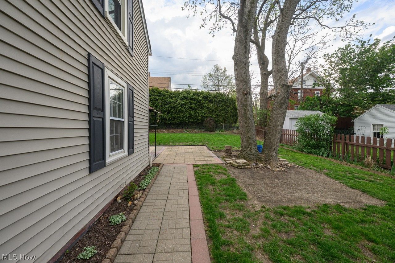 1422 Monument Road Northwest Canton, OH 44703 - Photo 27 of 31 Side of home with walkway to back patio