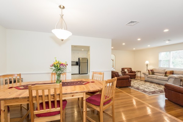 197 Evelyn Road Newton, MA 02468 - Photo 4 of 18 a living room with furniture a chandelier and a dining table
