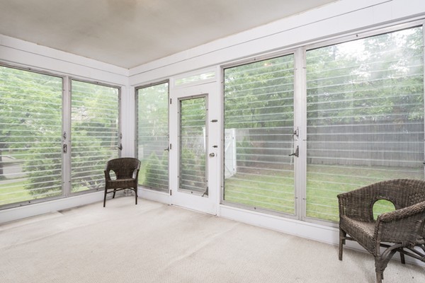 197 Evelyn Road Newton, MA 02468 - Photo 9 of 18 a living room filled with furniture and a window