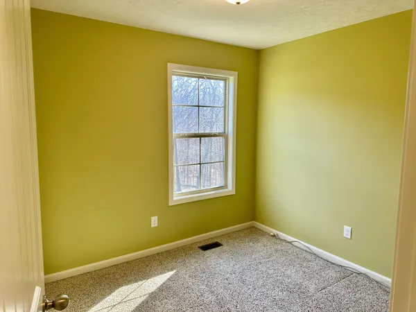 a view of a room with toys and painted walls