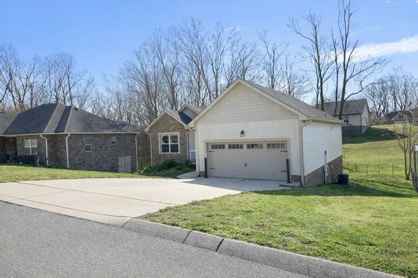 a view of a house with a yard