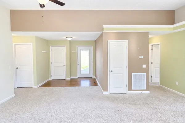 a kitchen with stainless steel appliances a stove a sink and a refrigerator