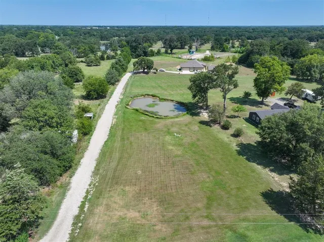 a view of a yard with a swimming pool