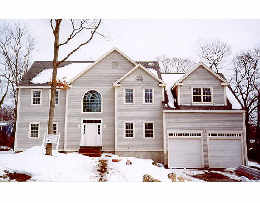 51 Woodledge Road Needham, MA 02492 - Photo 1 of 1 a front view of a house with a yard