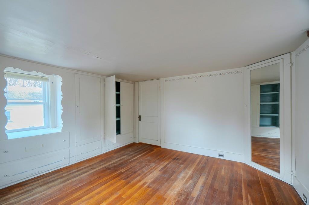 183 South Road Pepperell, MA 01463 - Photo 16 of 27 an empty room with wooden floor and windows