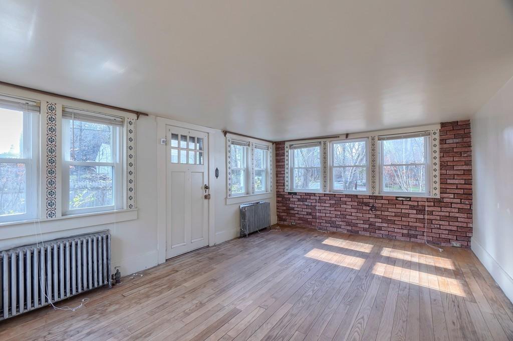 183 South Road Pepperell, MA 01463 - Photo 3 of 27 wooden floor in an empty room with a window