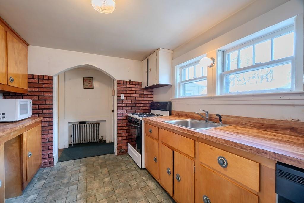 183 South Road Pepperell, MA 01463 - Photo 9 of 27 a kitchen with a stove and a sink