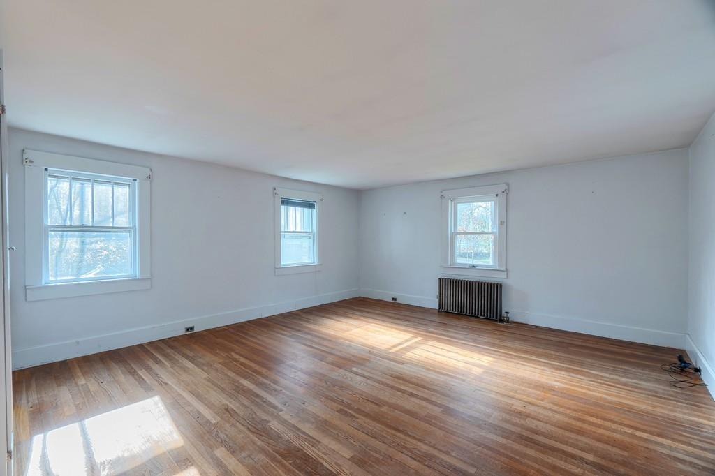 183 South Road Pepperell, MA 01463 - Photo 10 of 27 a view of an empty room with wooden floor and a window