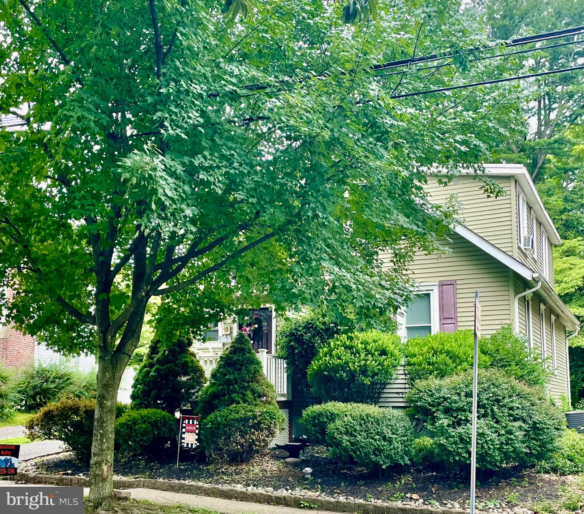 a view of a house with a tree