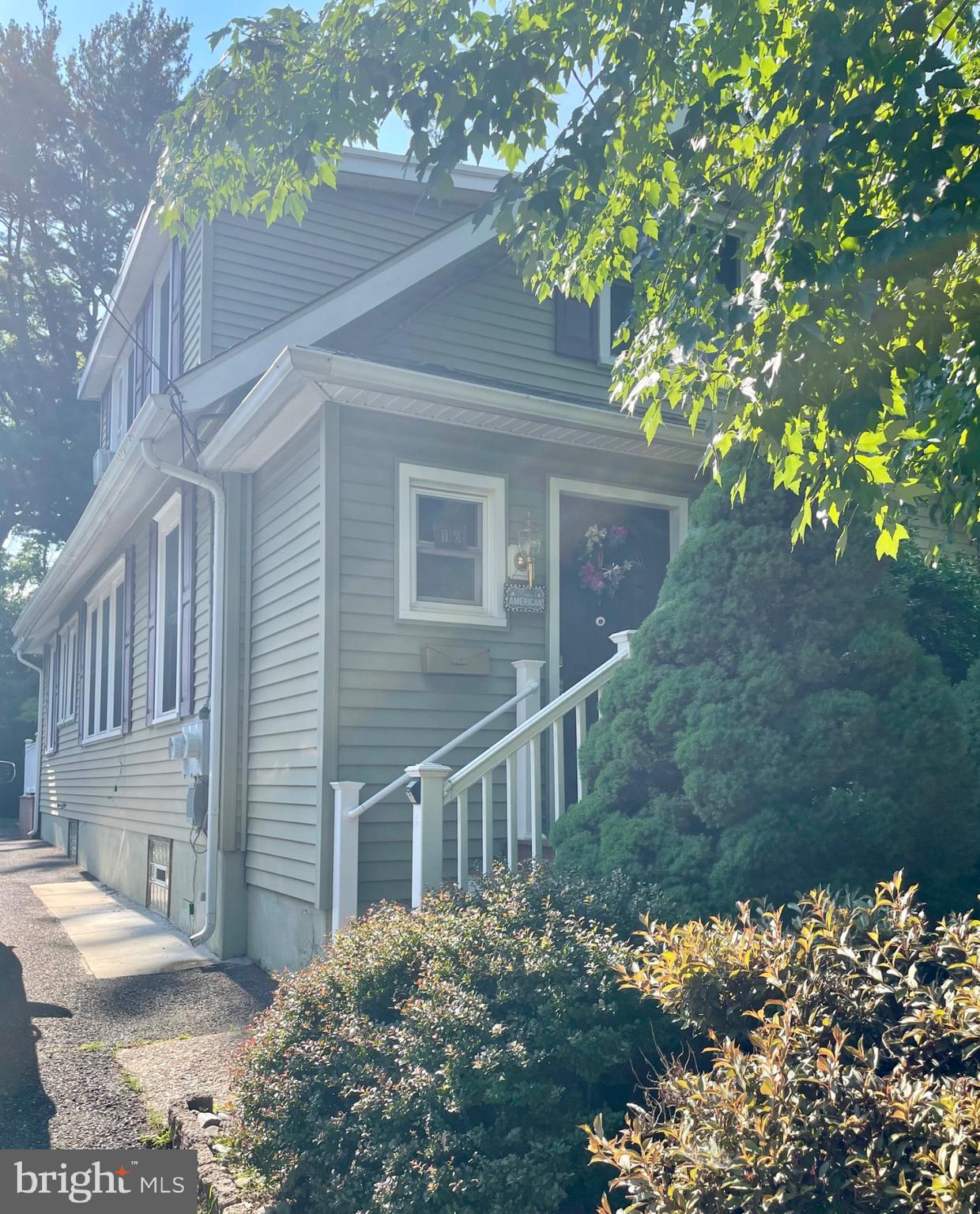 16 Evergreen Lane Haddonfield, NJ 08033 - Photo 2 of 16 a view of a house with a yard and a garden