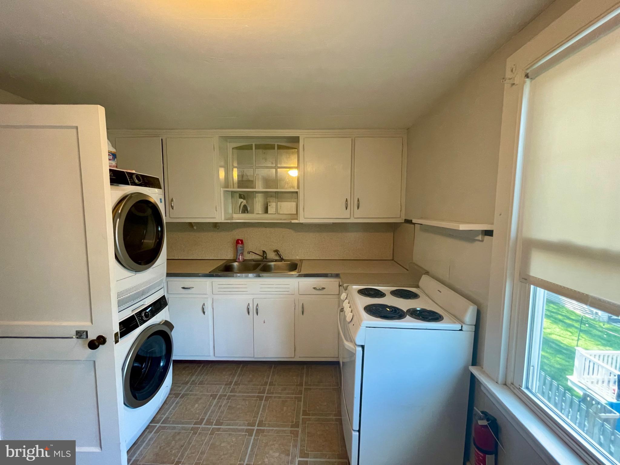 16 Evergreen Lane Haddonfield, NJ 08033 - Photo 7 of 16 a utility room with sink dryer and washer