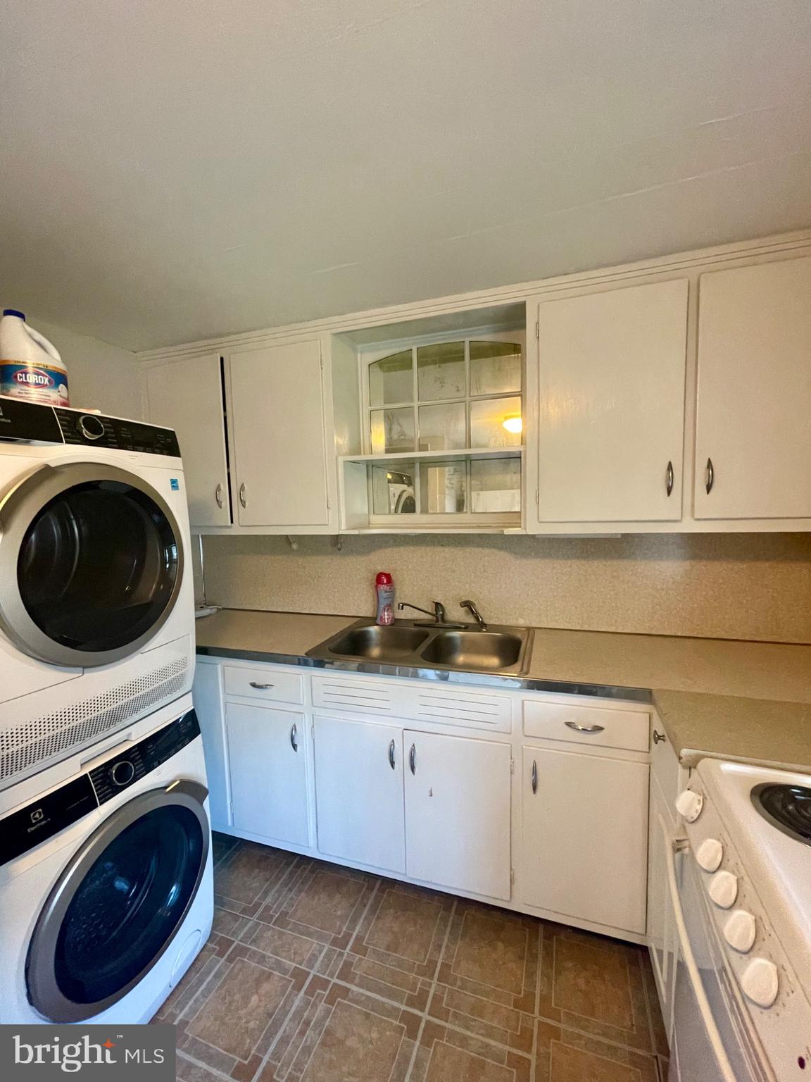 16 Evergreen Lane Haddonfield, NJ 08033 - Photo 9 of 16 a kitchen with a sink a stove and cabinets