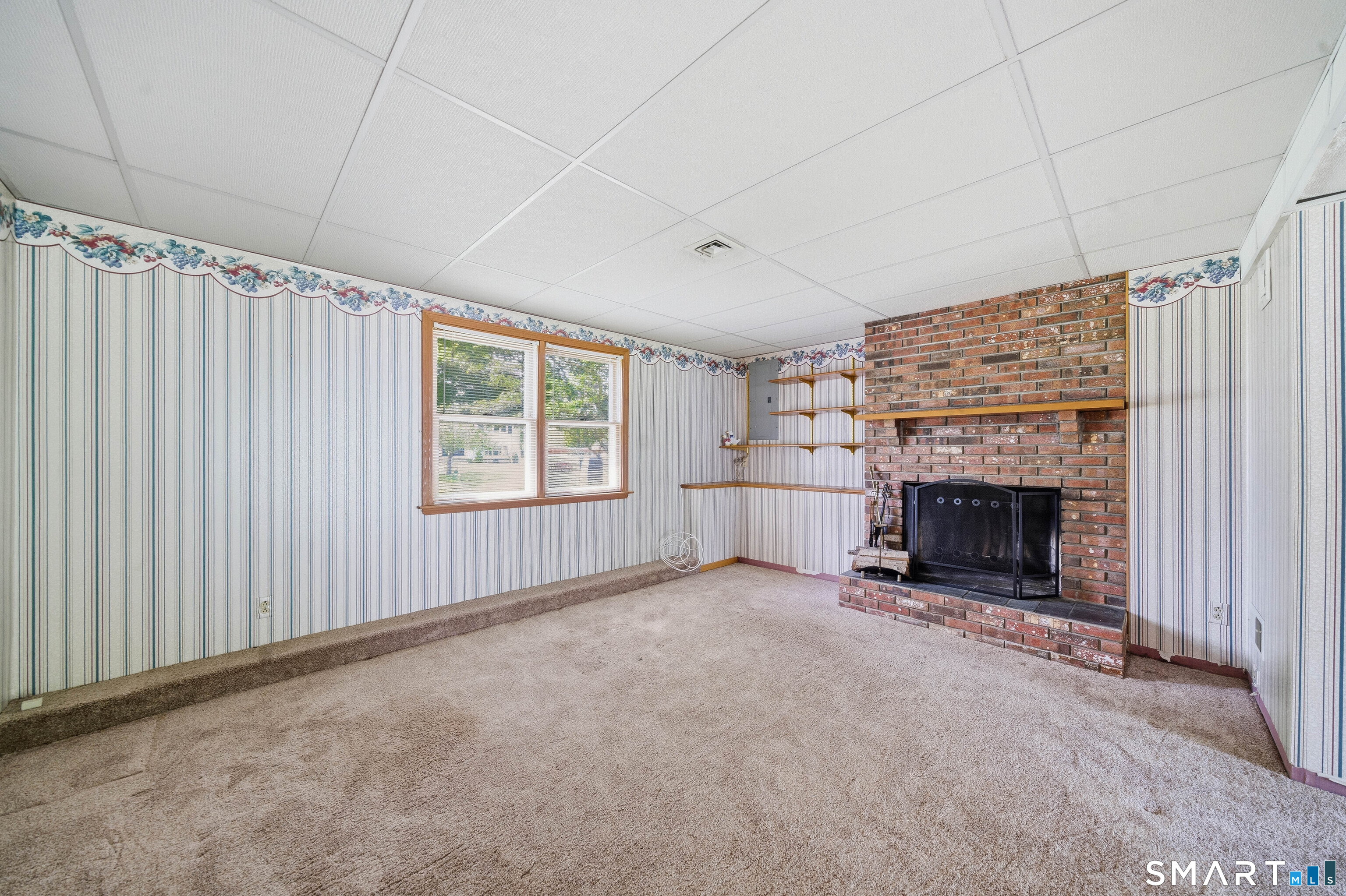 17 Spruceland Road Enfield, CT 06082 - Photo 29 of 40 Lower level family room with added shelving
