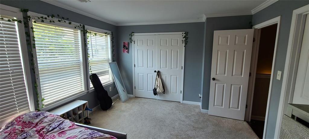 4434 Lassen Court Suwanee, GA 30024 - Photo 14 of 46 a view of a hallway with furniture and a window