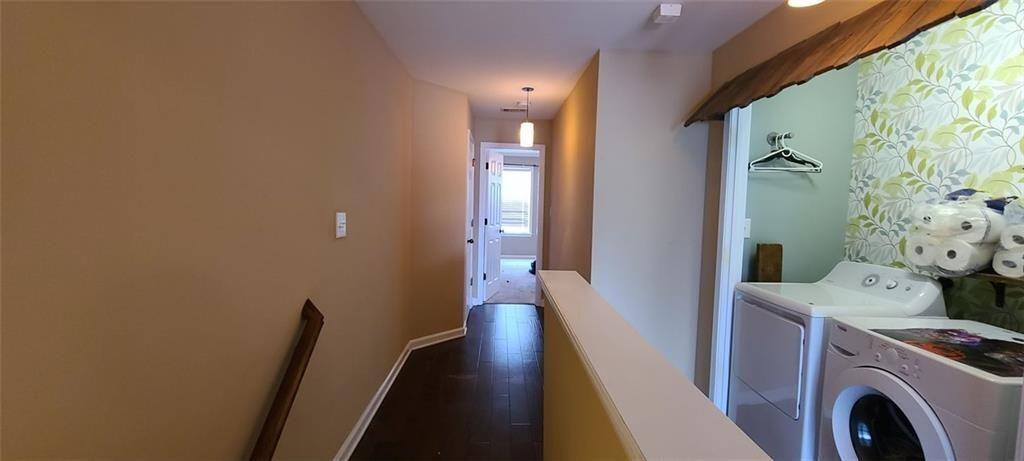 4434 Lassen Court Suwanee, GA 30024 - Photo 18 of 46 a view of a hallway with washer and dryer