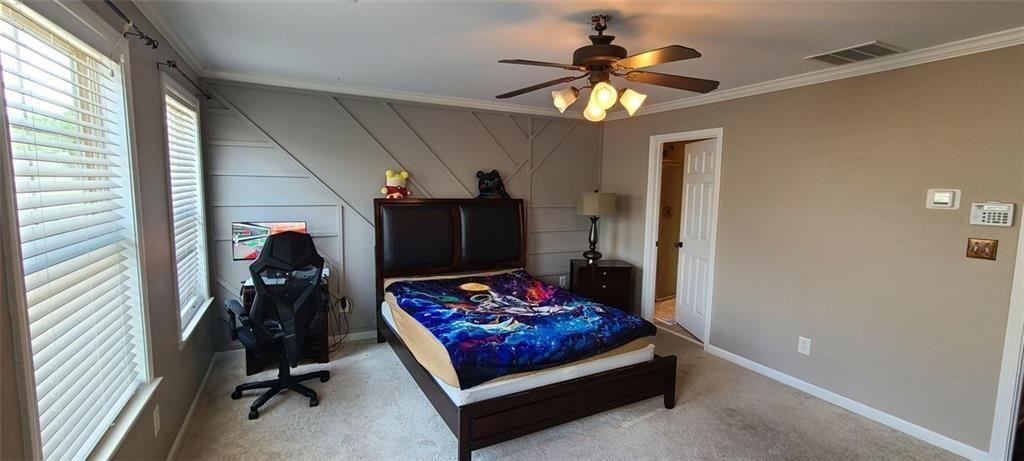 4434 Lassen Court Suwanee, GA 30024 - Photo 19 of 46 a living room with furniture and a flat screen tv