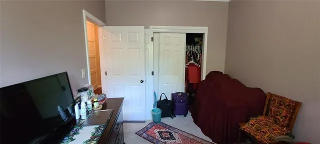 a room with cabinets and flat screen tv