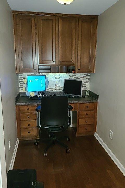 4434 Lassen Court Suwanee, GA 30024 - Photo 32 of 46 a room with cabinets and flat screen tv