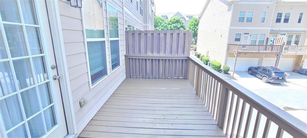 4434 Lassen Court Suwanee, GA 30024 - Photo 42 of 46 a view of a balcony with wooden floor