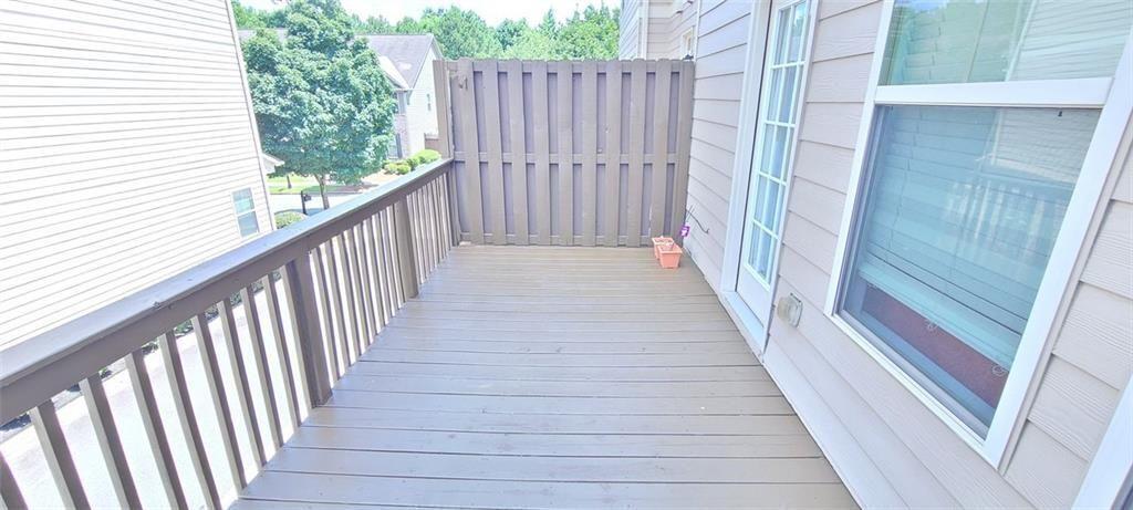 4434 Lassen Court Suwanee, GA 30024 - Photo 43 of 46 a view of a balcony with wooden floor