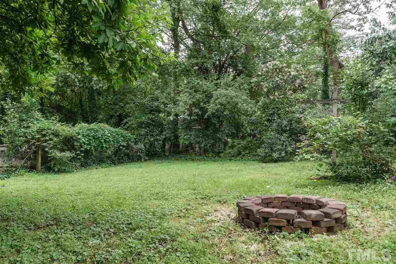 804 Sasser Street Raleigh, NC 27604 - Photo 14 of 15 a backyard of a house with lots of green space