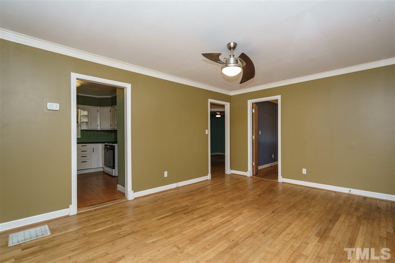804 Sasser Street Raleigh, NC 27604 - Photo 5 of 15 a view of an empty room with wooden floor