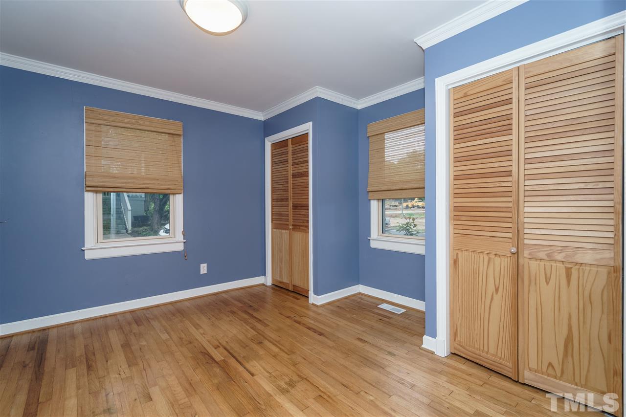 804 Sasser Street Raleigh, NC 27604 - Photo 10 of 15 a view of an empty room with wooden floor and a window