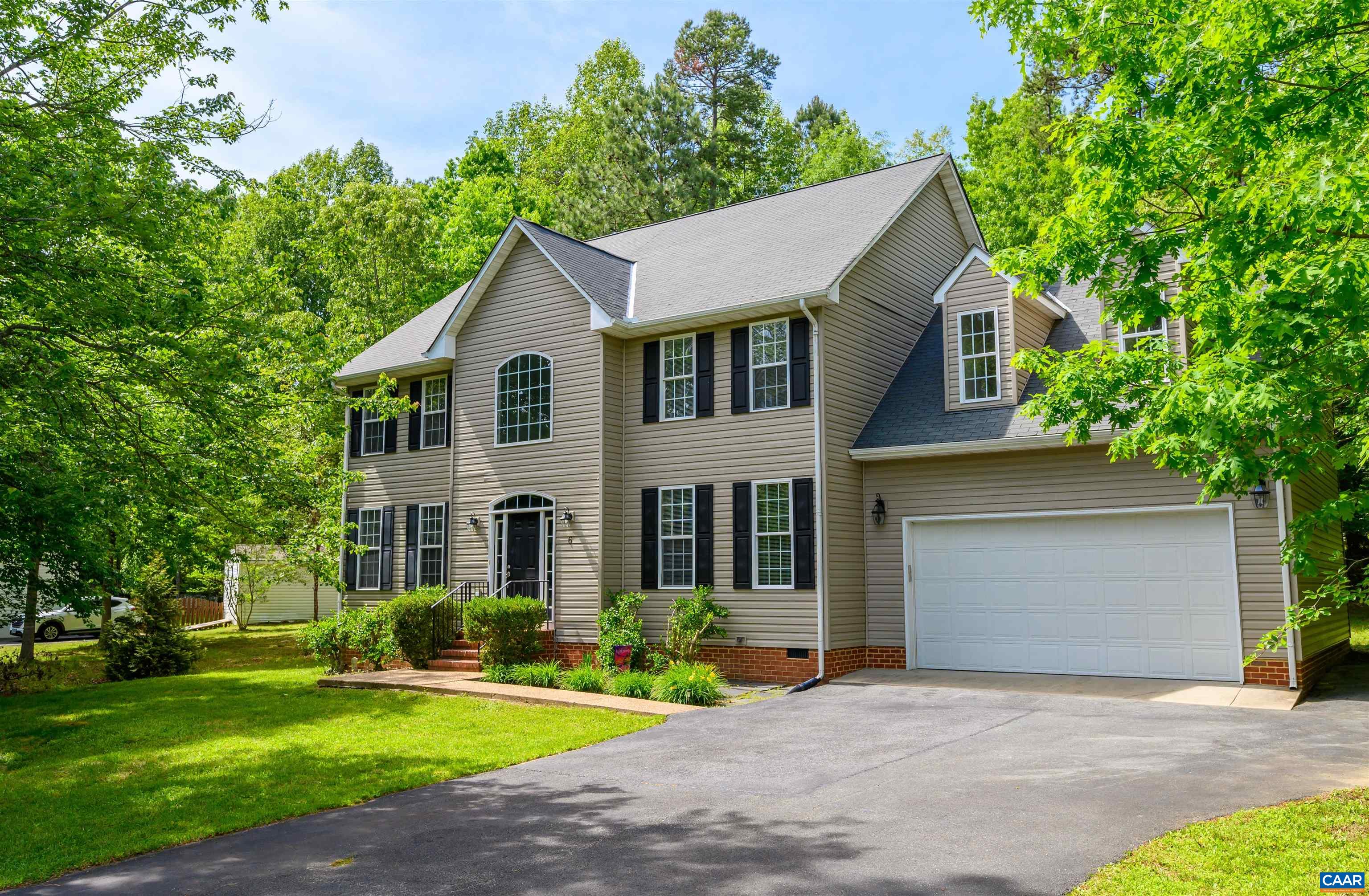 6 Loblolly Road Palmyra, VA 22963 - Photo 1 of 44 a front view of a house with a yard and garage