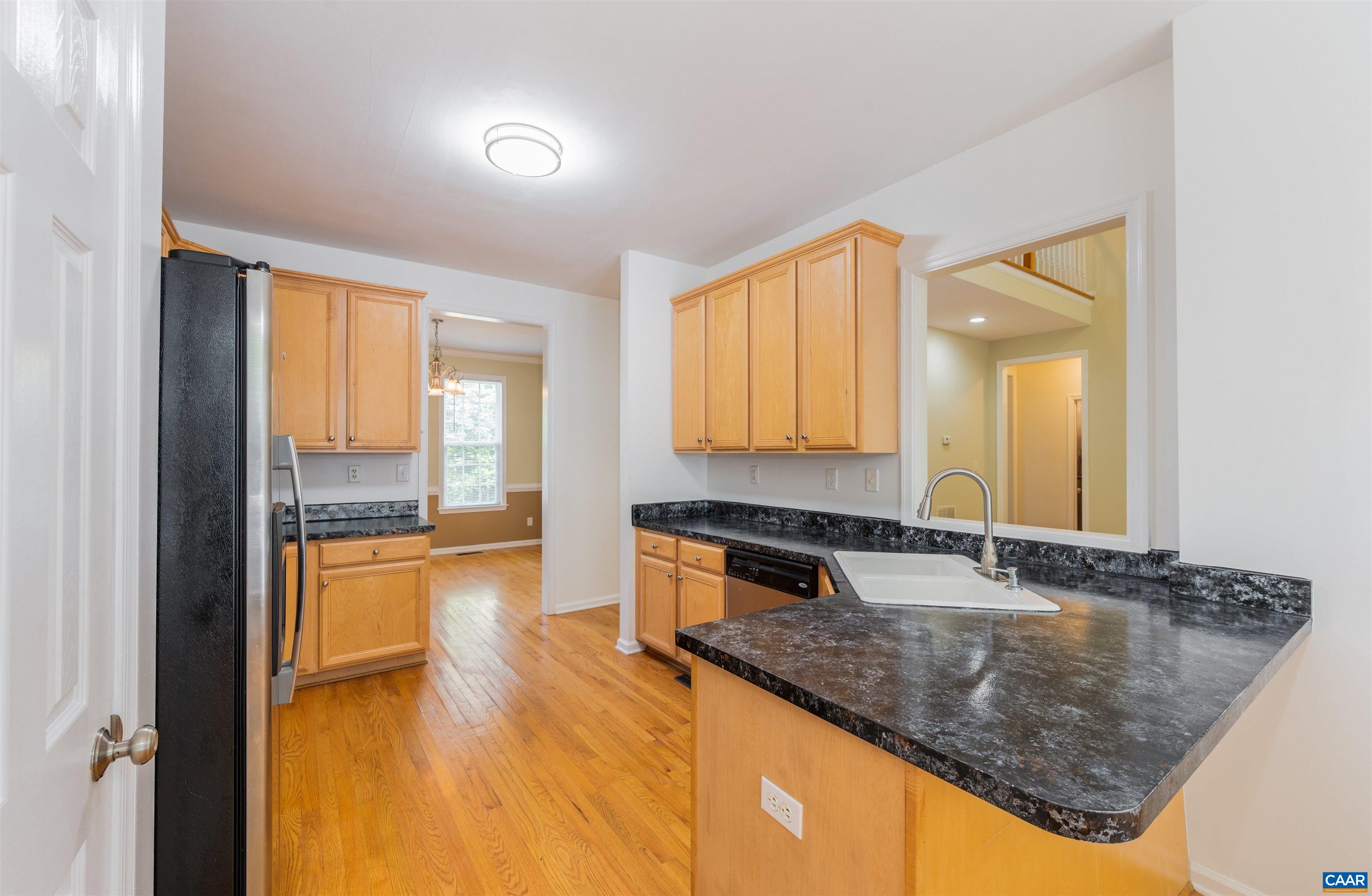 6 Loblolly Road Palmyra, VA 22963 - Photo 17 of 44 a kitchen with stainless steel appliances granite countertop sink stove and cabinets