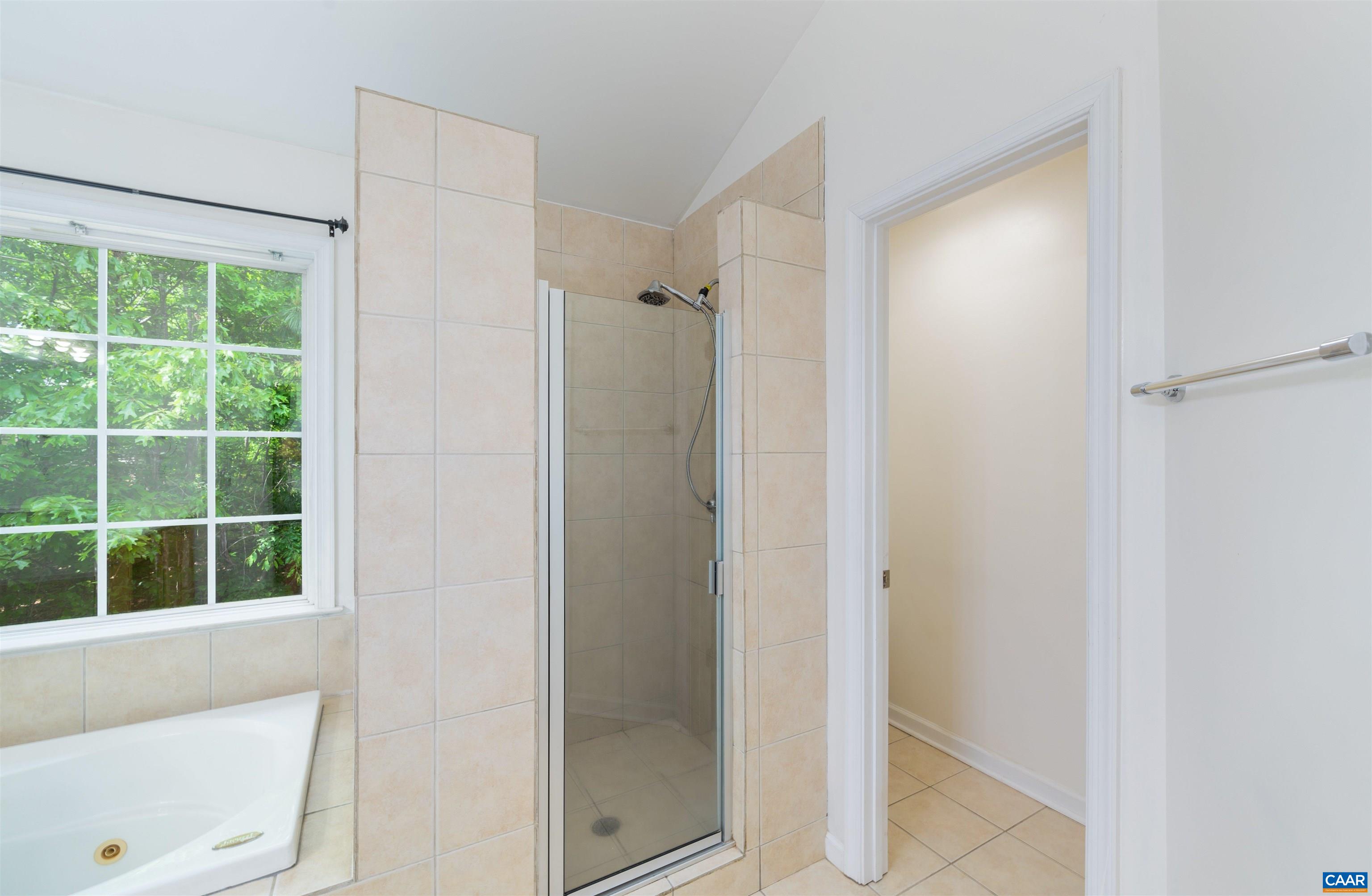 6 Loblolly Road Palmyra, VA 22963 - Photo 28 of 44 a bathroom with a shower and a window