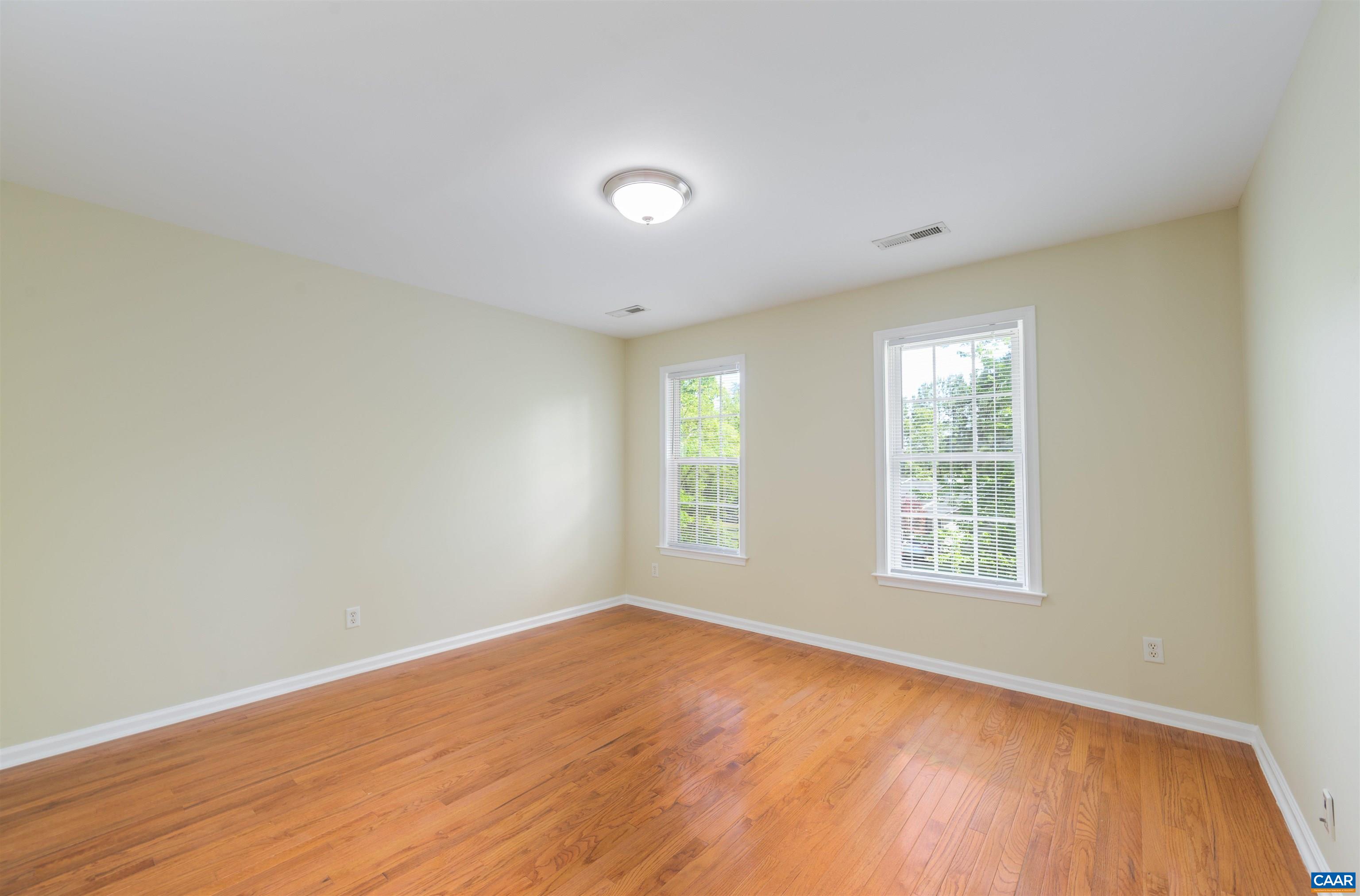 6 Loblolly Road Palmyra, VA 22963 - Photo 30 of 44 an empty room with wooden floor and windows