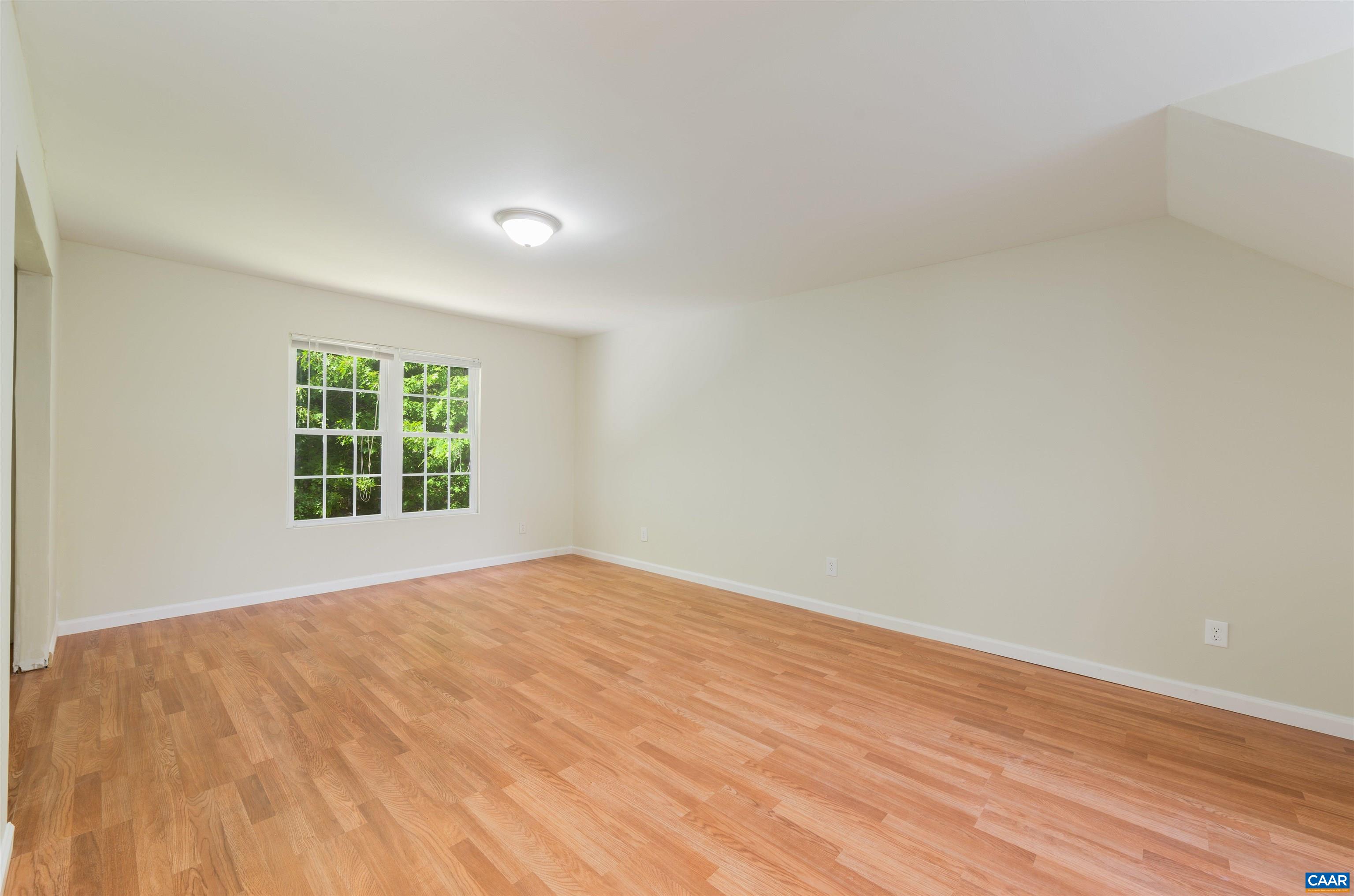 6 Loblolly Road Palmyra, VA 22963 - Photo 33 of 44 a view of an empty room with wooden floor and a window