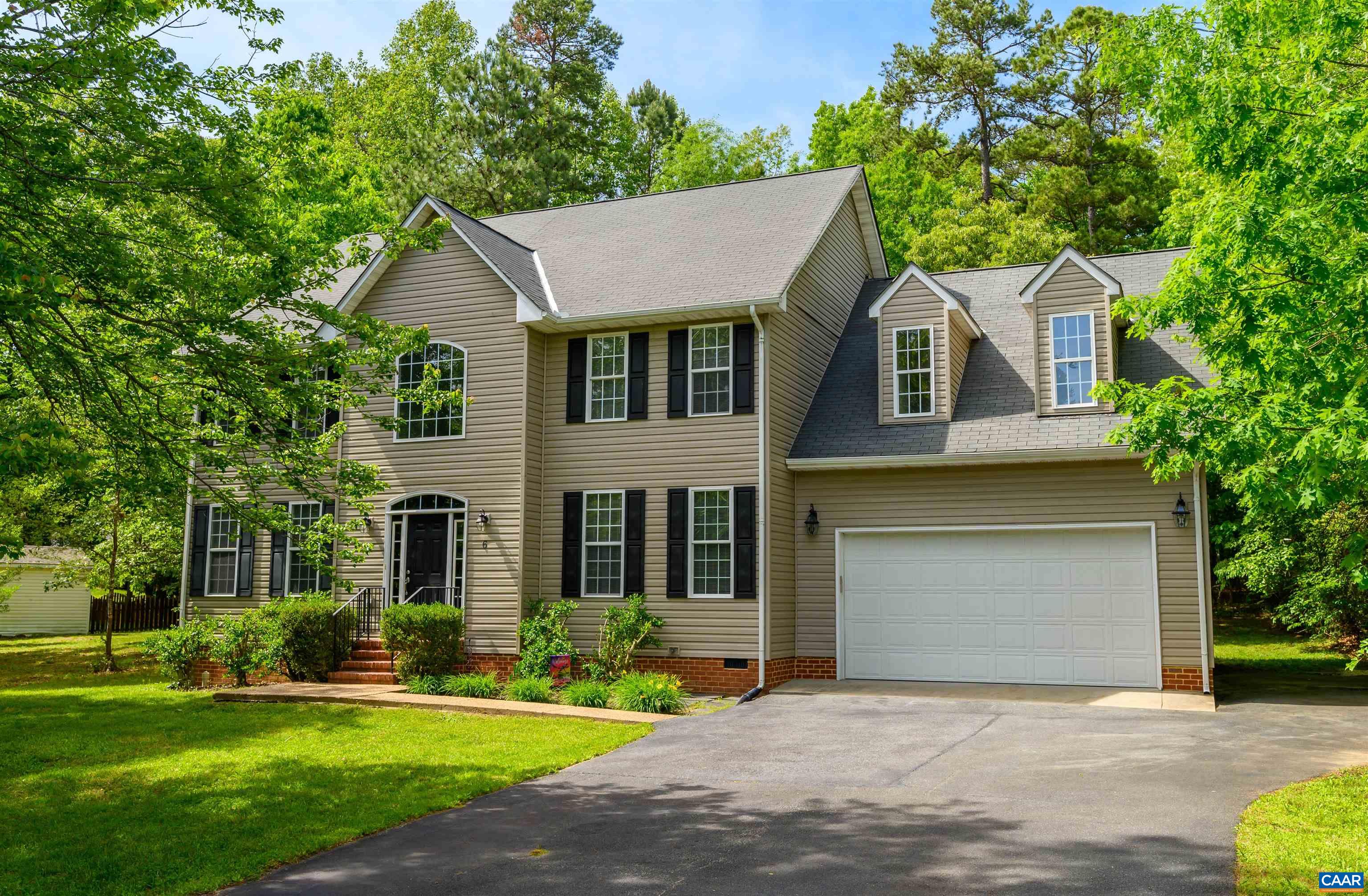 6 Loblolly Road Palmyra, VA 22963 - Photo 36 of 44 a front view of a house with a yard and garage
