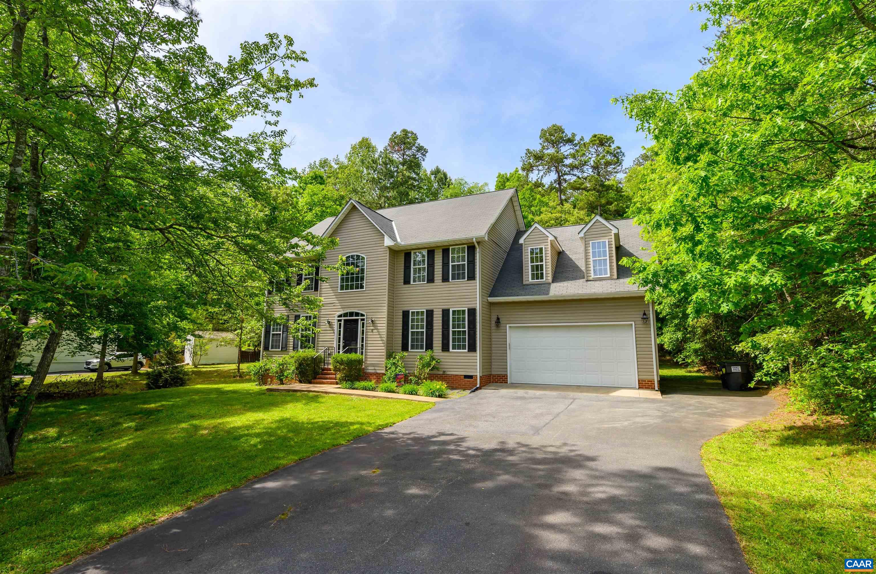 6 Loblolly Road Palmyra, VA 22963 - Photo 7 of 44 a front view of a house with a yard and trees