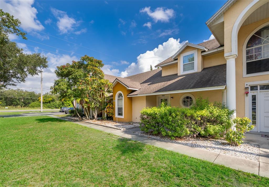 3135 Enclave Court Kissimmee, FL 34746 - Photo 1 of 22 a front view of a house with a yard