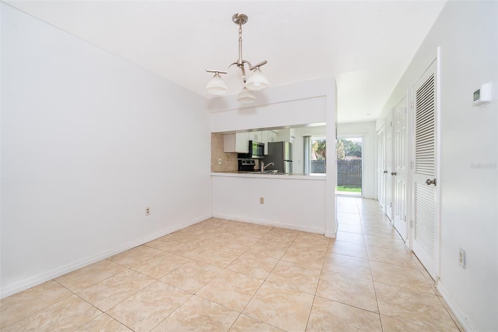 3135 Enclave Court Kissimmee, FL 34746 - Photo 16 of 22 a view of a room with a ceiling fan and window