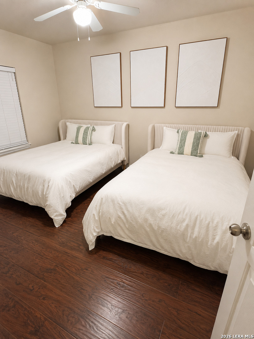 6160 Eckhert Road, Unit 804 San Antonio, TX 78240 - Photo 13 of 38 a bedroom with two beds and wooden floor