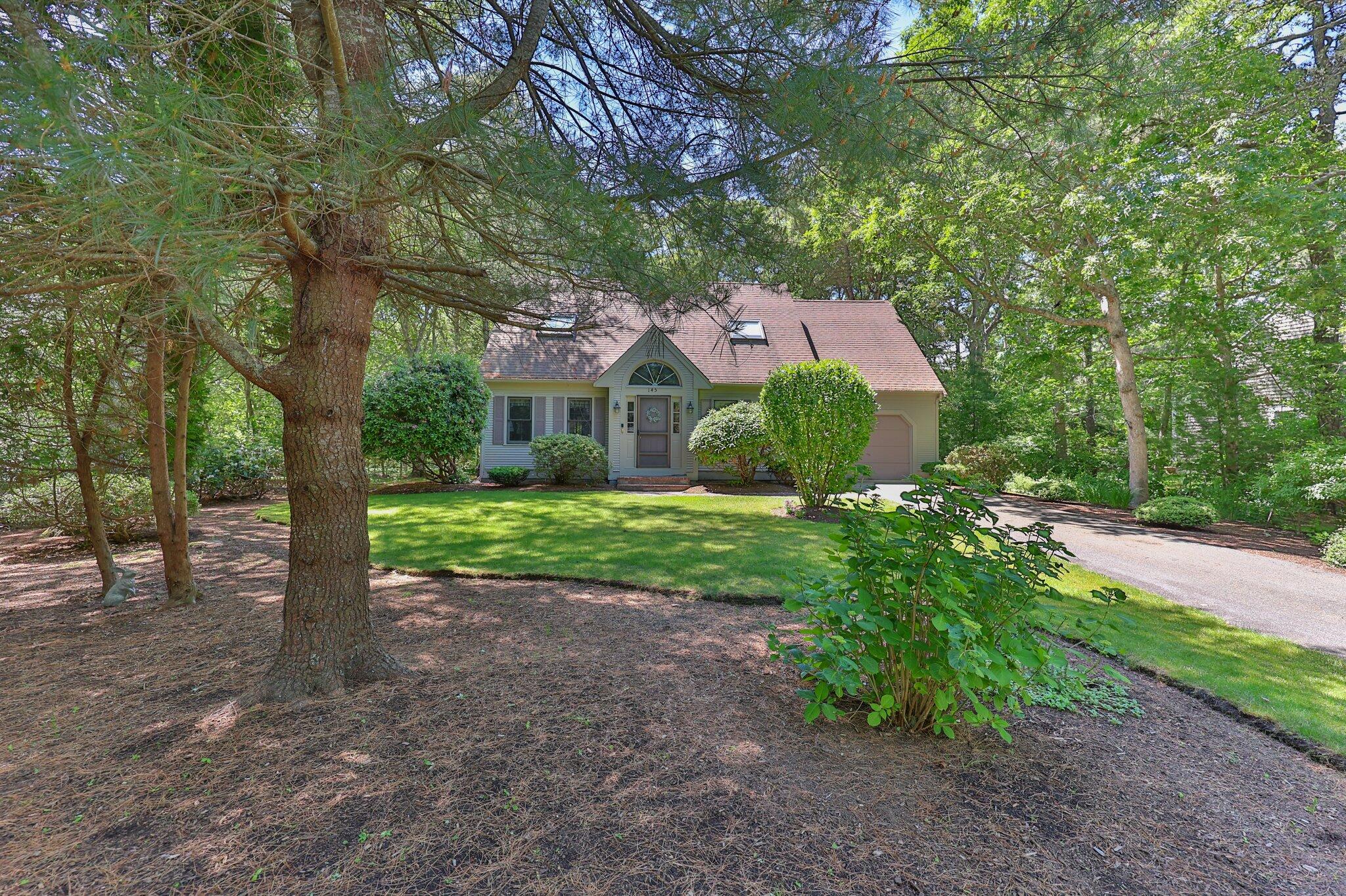 145 Braley Jenkins Road Centerville, MA 02632 - Photo 1 of 33 a view of a house with a yard
