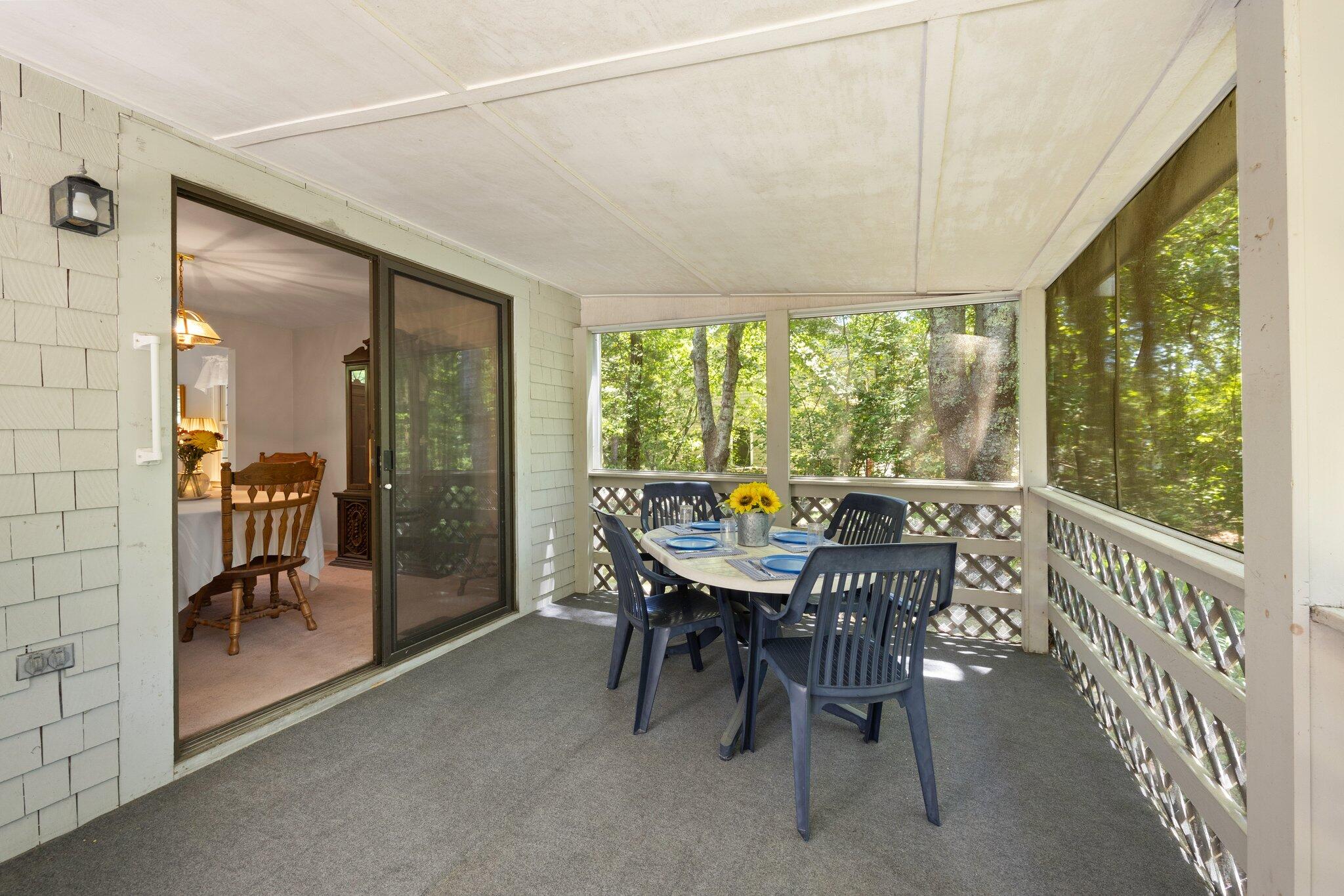 145 Braley Jenkins Road Centerville, MA 02632 - Photo 11 of 33 a view of a dining room with furniture window and outside view