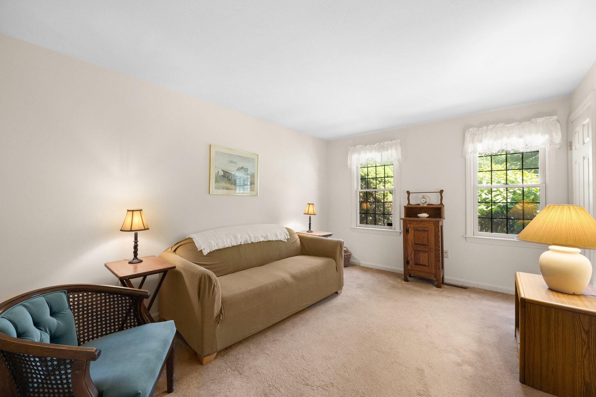 145 Braley Jenkins Road Centerville, MA 02632 - Photo 15 of 33 a living room with furniture and a window