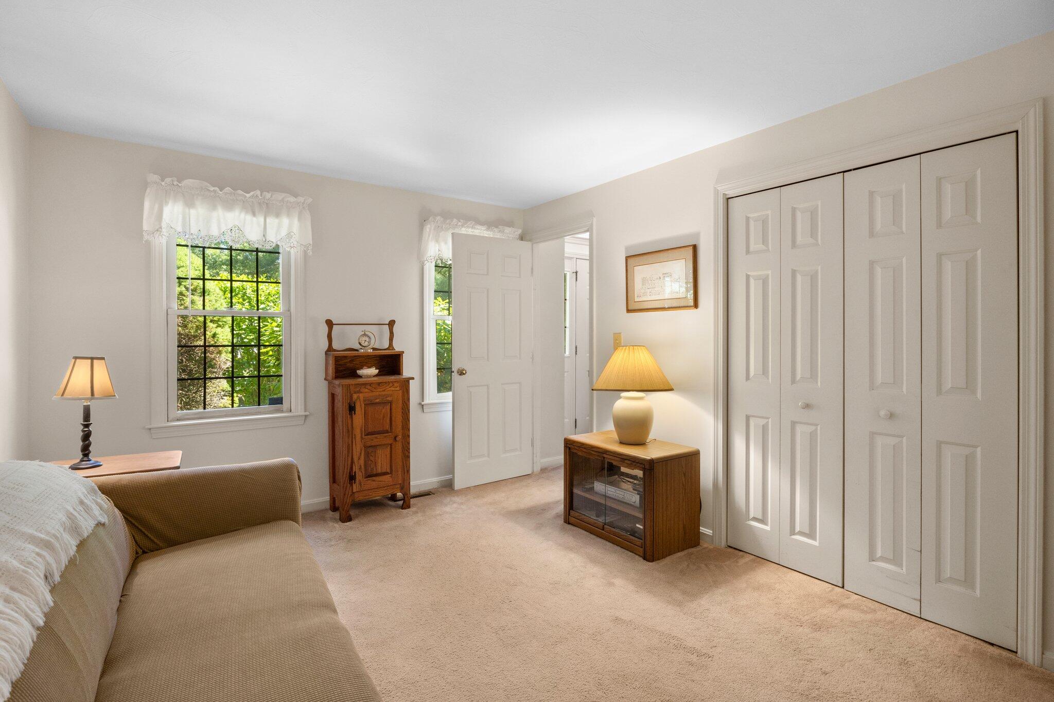 145 Braley Jenkins Road Centerville, MA 02632 - Photo 16 of 33 a bedroom with a bed and a window