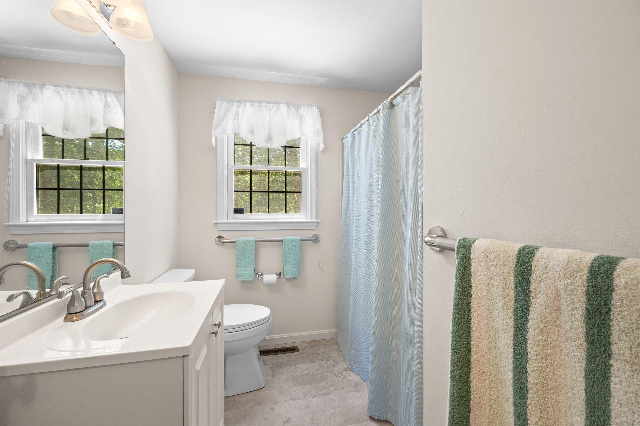 145 Braley Jenkins Road Centerville, MA 02632 - Photo 17 of 33 a bathroom with a sink toilet and mirror