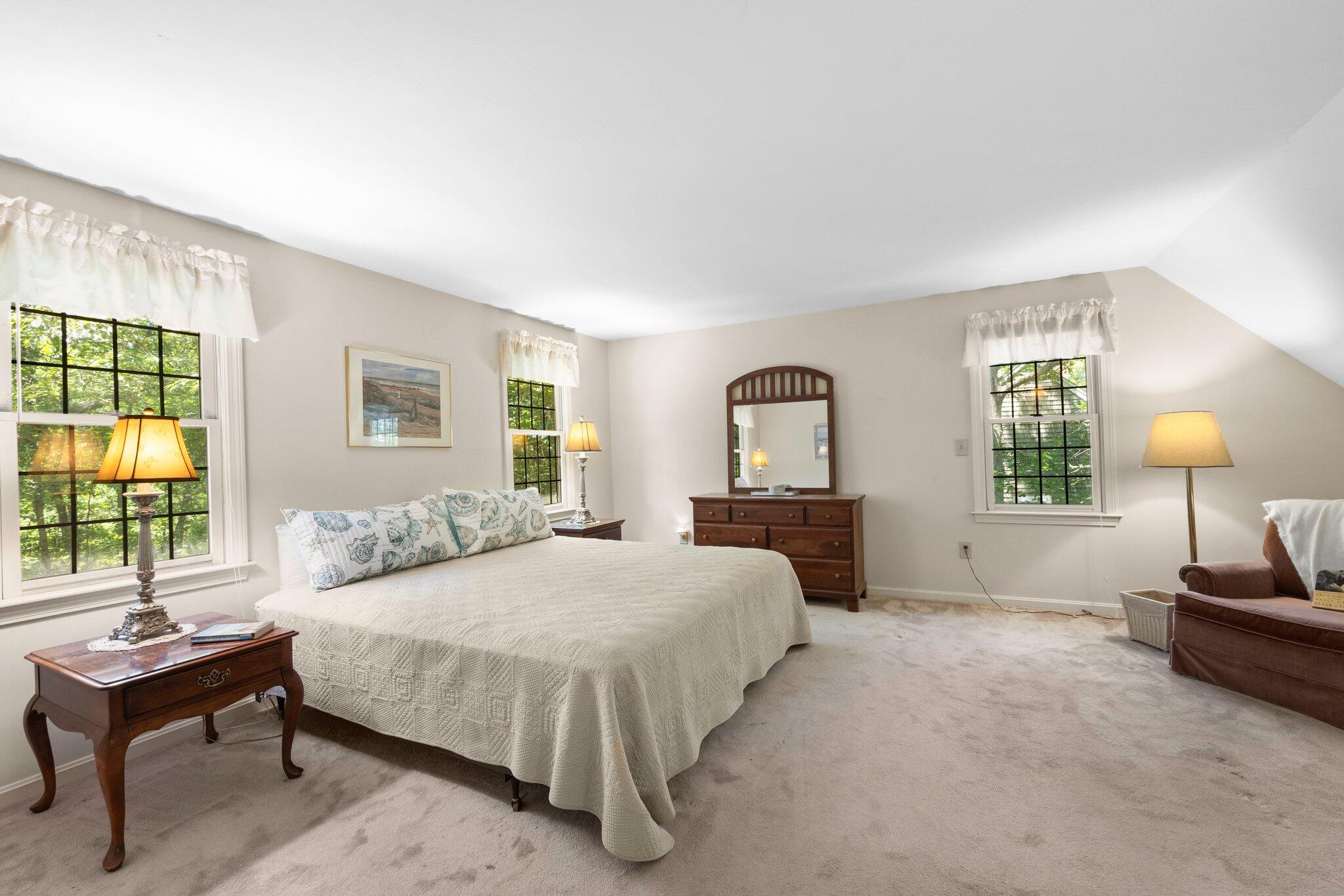 145 Braley Jenkins Road Centerville, MA 02632 - Photo 20 of 33 a bedroom with a bed and a couch