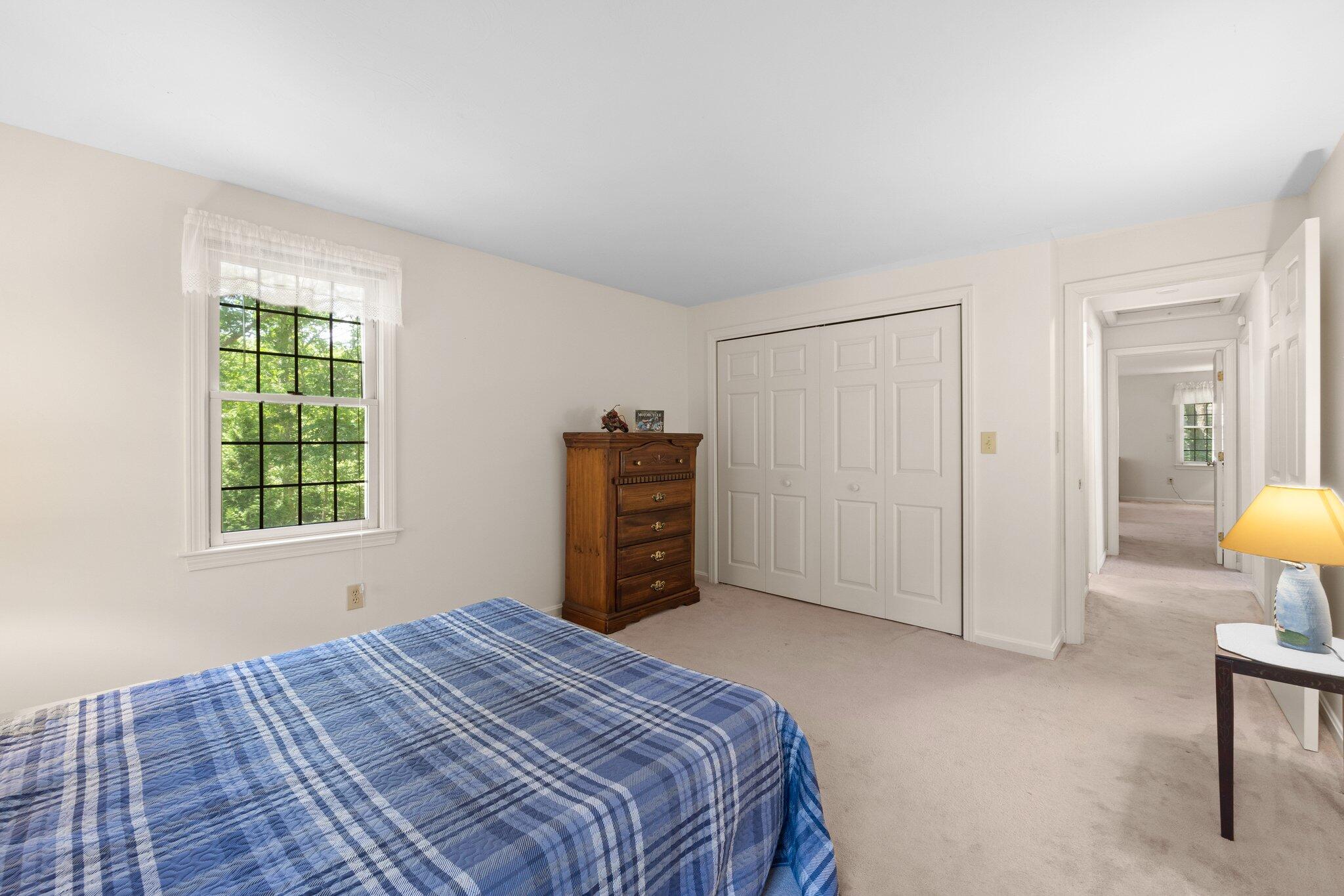 145 Braley Jenkins Road Centerville, MA 02632 - Photo 22 of 33 a bedroom with a bed and a cabinets