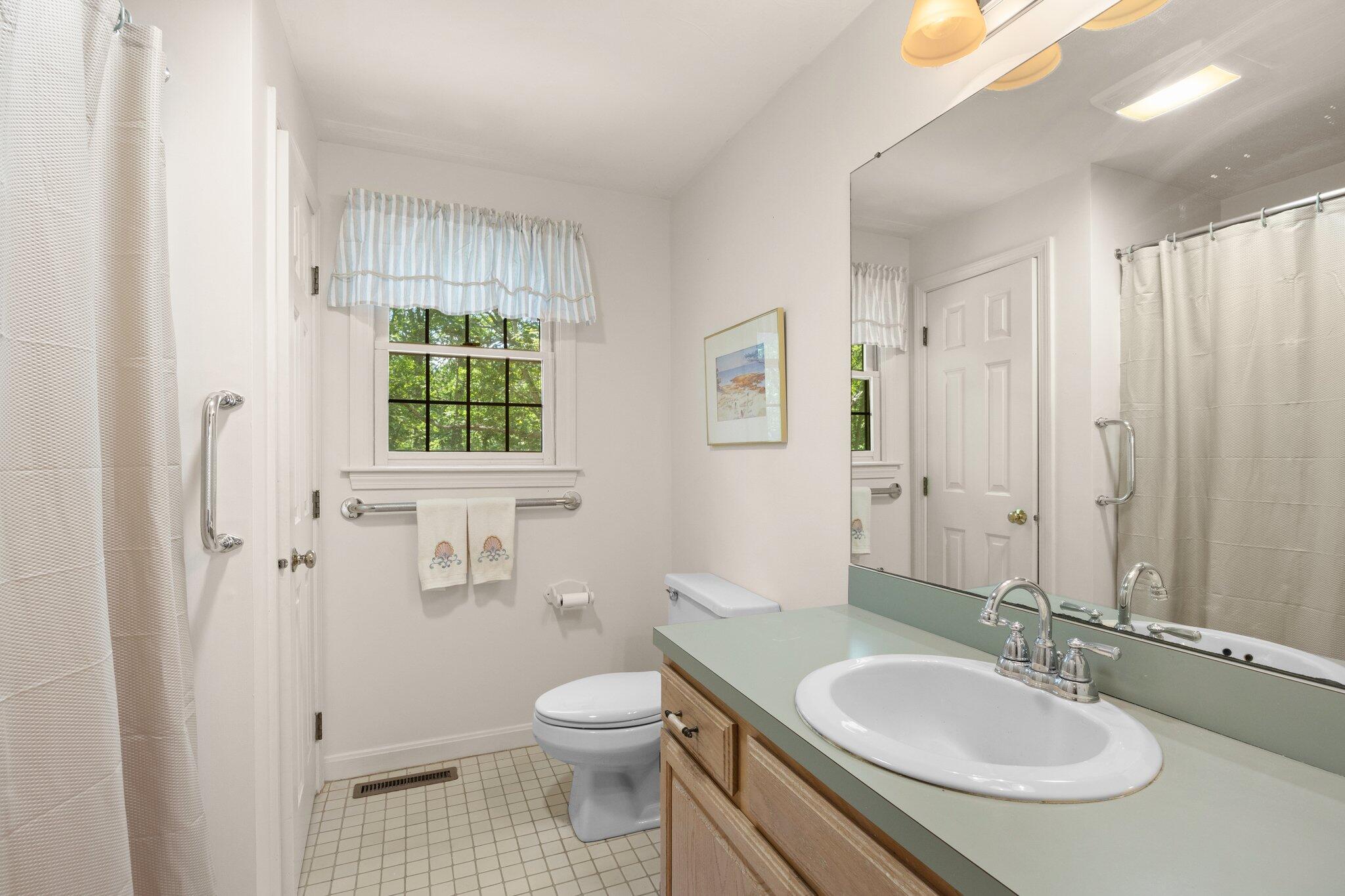 145 Braley Jenkins Road Centerville, MA 02632 - Photo 24 of 33 a bathroom with a granite countertop sink toilet and shower