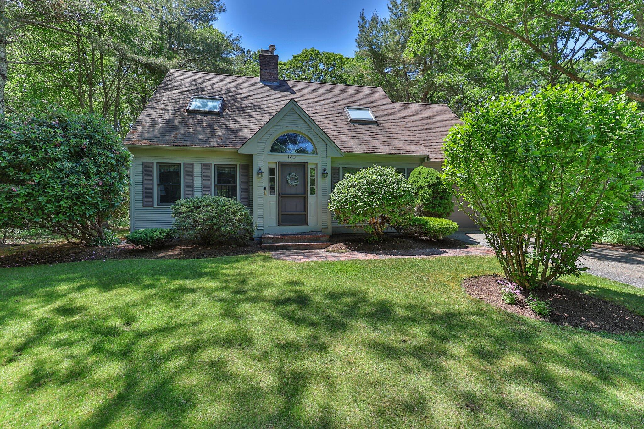 145 Braley Jenkins Road Centerville, MA 02632 - Photo 3 of 33 a front view of house with yard and green space