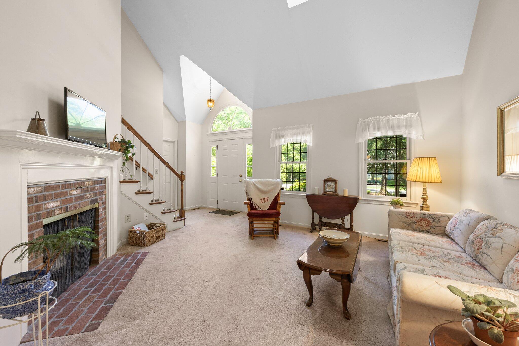 145 Braley Jenkins Road Centerville, MA 02632 - Photo 6 of 33 a living room with furniture and a fireplace