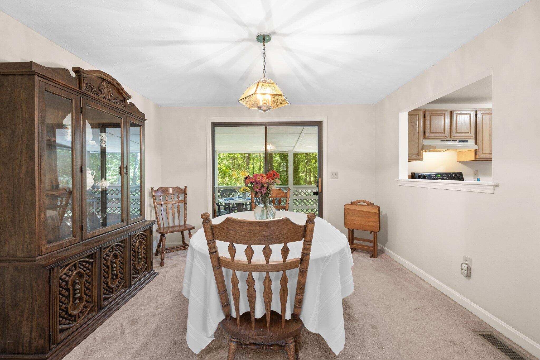 145 Braley Jenkins Road Centerville, MA 02632 - Photo 9 of 33 a dining room with furniture a chandelier and wooden floor